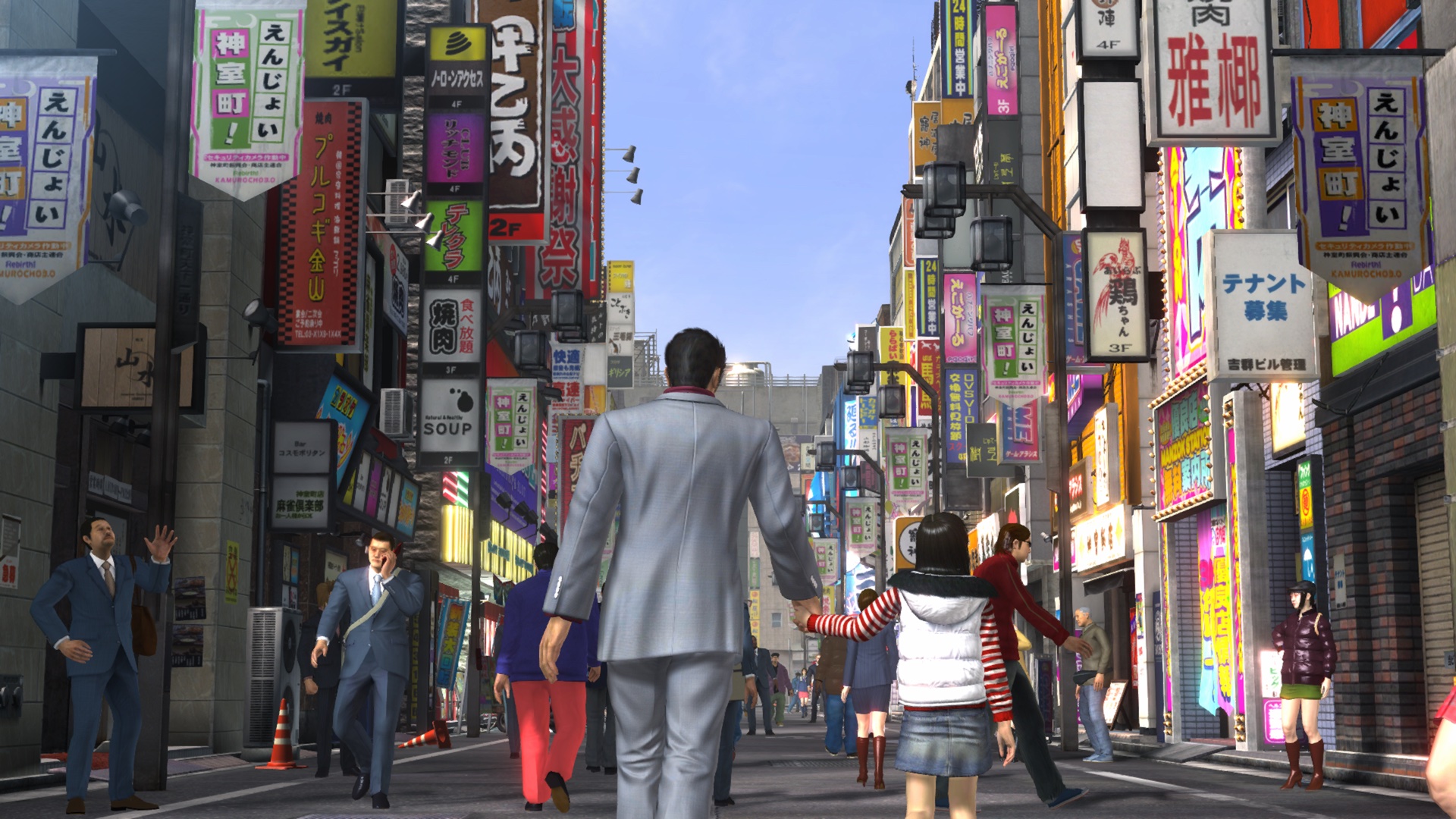 Kiryu and Haruka holding hands strolling through Kamurocho.